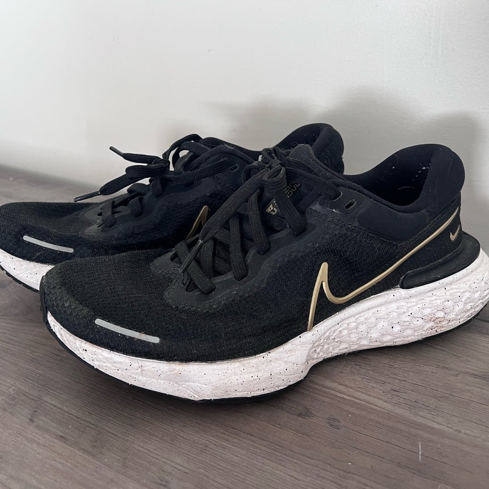 Nike Zoomx Invincible Run Flyknit. Black and Gold Athletic Sneakers